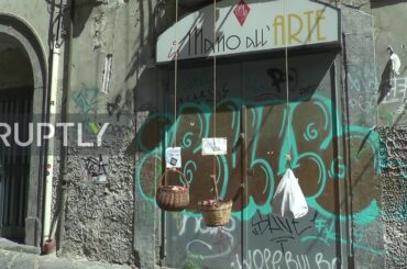 Italy: Neapolitan supplies needy using baskets from his balcony during COVID-19 lockdown