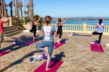 Tree pose on a luxury yoga retreat in Sicily Italy.
