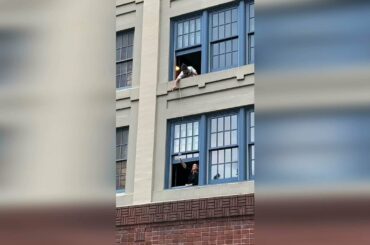 Portland neighbors share wine a floor apart while supporting coronavirus frontline workers