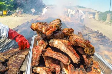 Italian Meat Street Food Festival. Huge Grills of Juicy Ribs, Sausages, Chicken and more