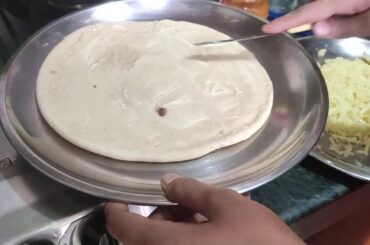 Thin italian pizza on gas stove / tandoor at home