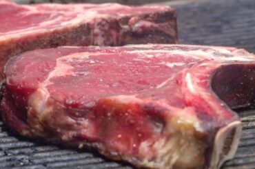 Huge Steaks of Italian Beef on Grill. Turin, Italy. Street Food