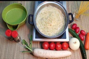 madam in cooking a spaghetti with tomato sauce