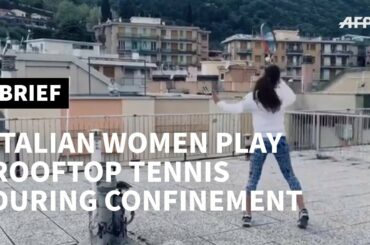 Italian women play rooftop tennis during confinement | AFP