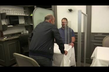 Table for two with plexiglass - is this Italy's future for eating out?