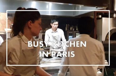 Busy kitchen and kitchen service at Maison by Sota Atsumi Restaurant in Paris, France