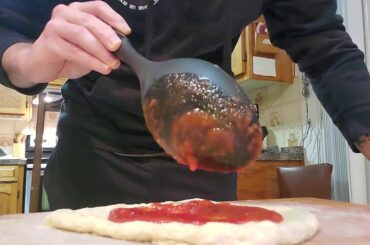 Basic pizza stretch and dressing