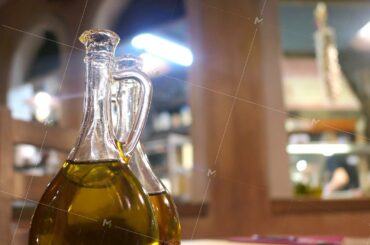 Bottles of olive oil in Italian restaurant