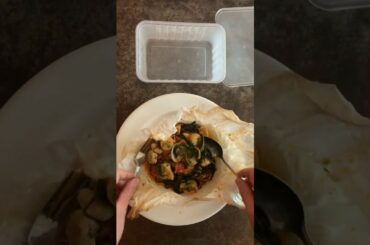 Beppi's famous Linguine Nero di Seppia alla marinara in Cartoccio.