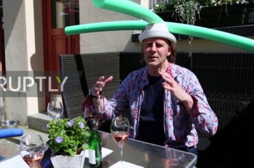 Germany: Schwerin restaurant offers social distancing hats on reopening day