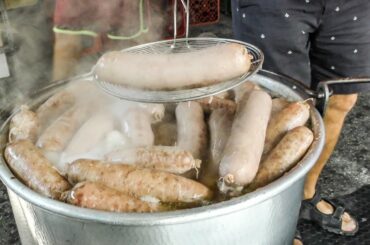 Italy Street Food. Huge Blocks of Meat, Giant Sausages Cooked and Cut