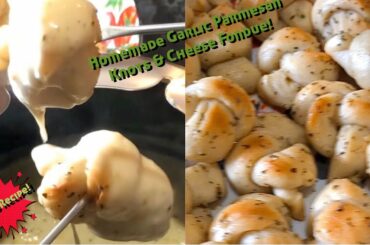 Homemade garlic Parmesan knots with wine Italian cheese fondue
