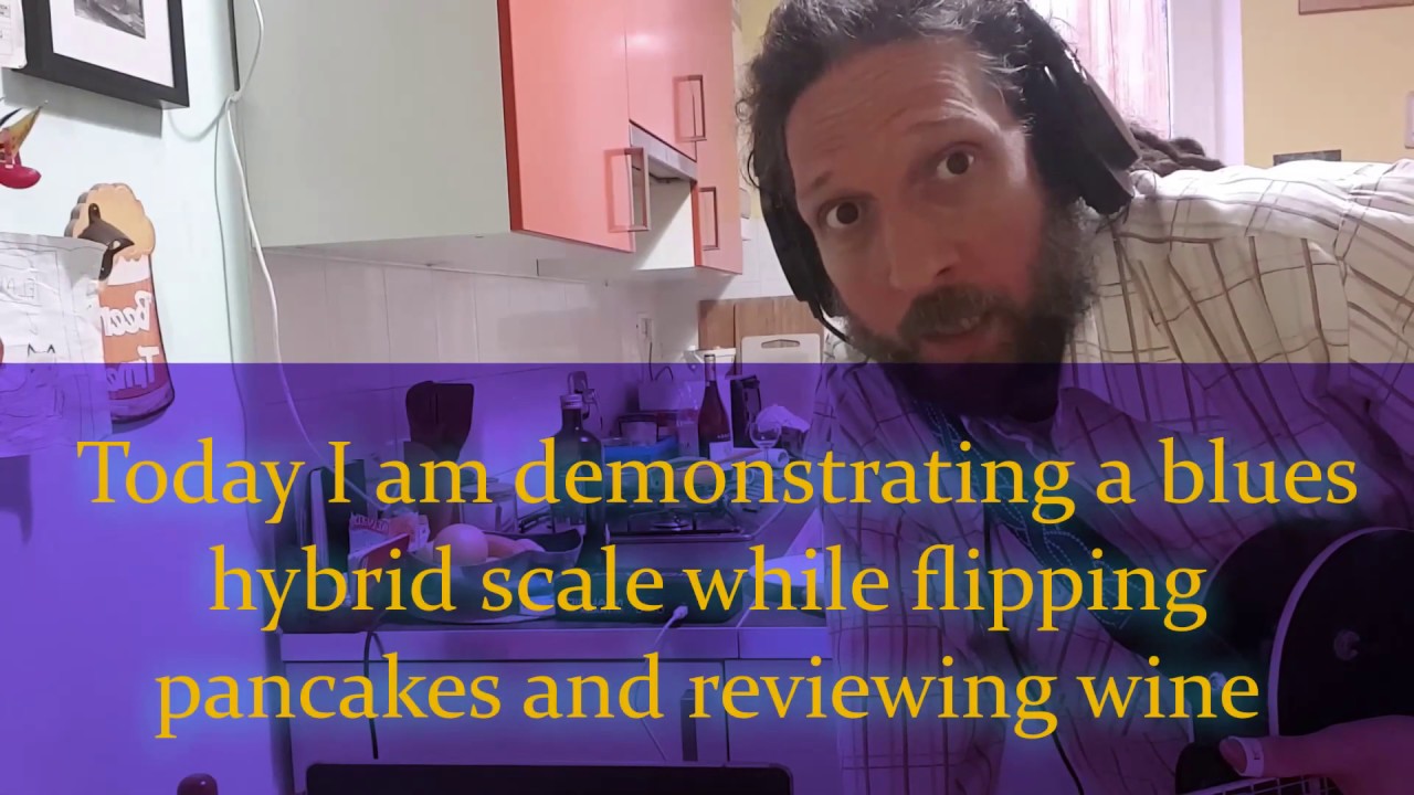 Blues Player Flips a Pancake While Jamming Guitar and Doing a Wine Review. Blues Player Flips a Pancake While Jamming Guitar and Doing a Wine Review.