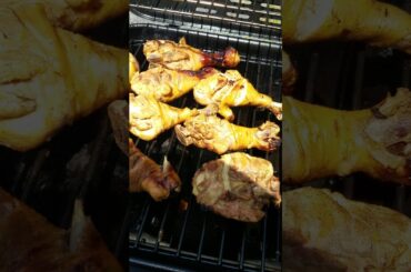 Cooking chicken and sweet italian sausages outside  hmm yum