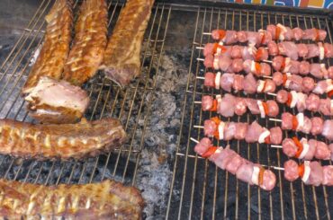 Italy Street Food. Grilled Sausages, Roasted Pigs, Ribs, Skewers and more Meat on Fire