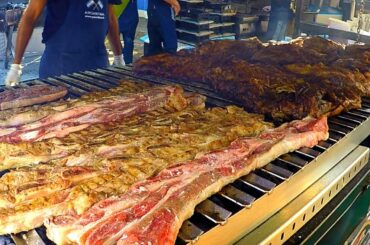 Italy Street Food Event. Huge Blocks of Meat on Grill, Asado, Super Loaded Sandwiches and more Food