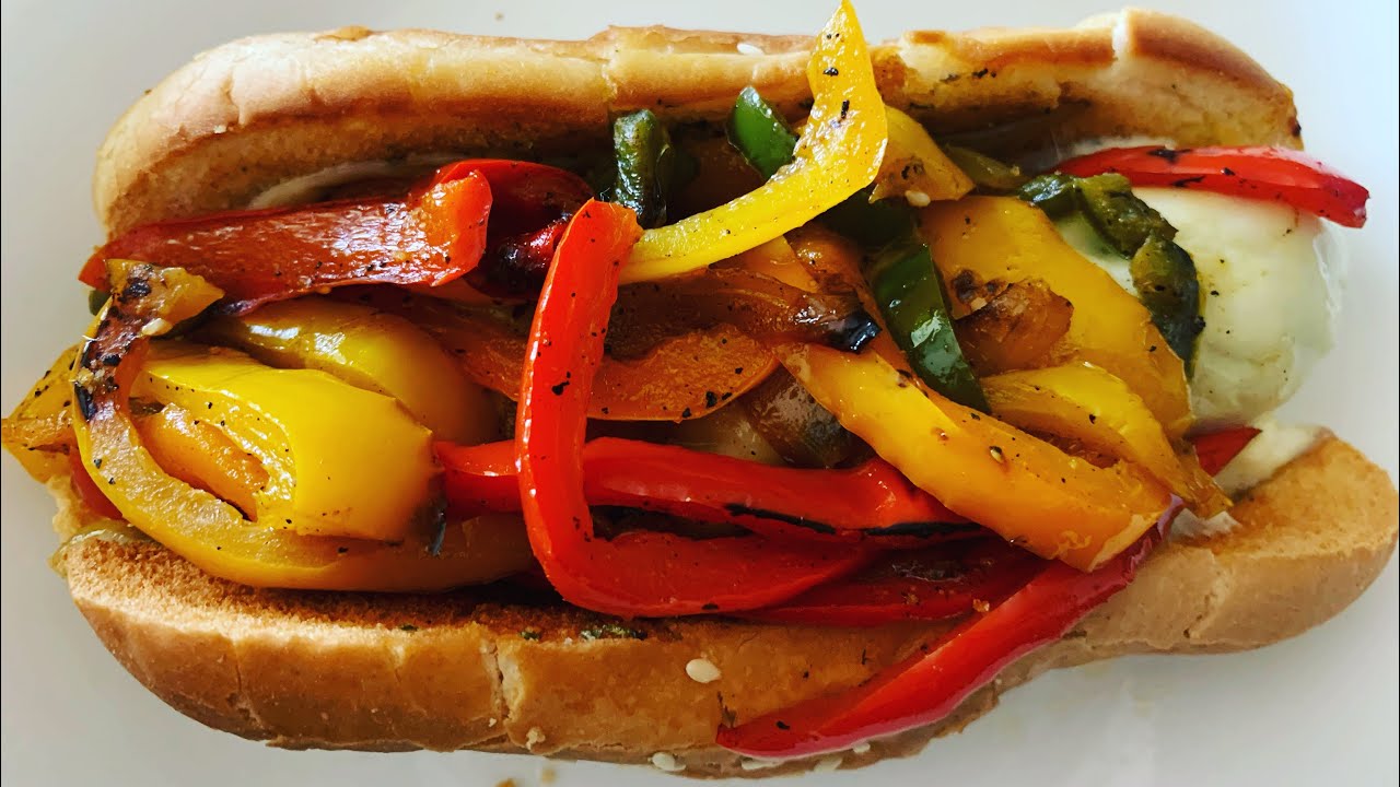 Italian sausage, provolone cheese, peppers & onions on a hoagie bun