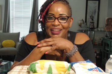 Subway served at my table. Spicy Italian sandwich with chips.