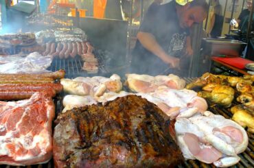 Street Food in Italy. Huge Juicy Ribs, Sausages, Pork Loin, Skewers and more Food from the World