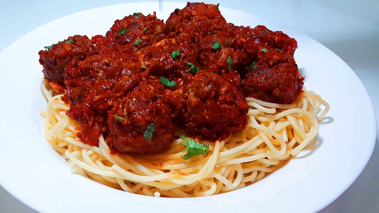 How To Make Spaghetti and Meatballs Italian Recipe by spoon of spices