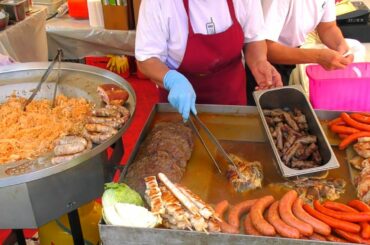 Europe Street Food. Huge Blocks of Beef, Sausages, Pulled Pork, Ham and more. Italy Food Festival