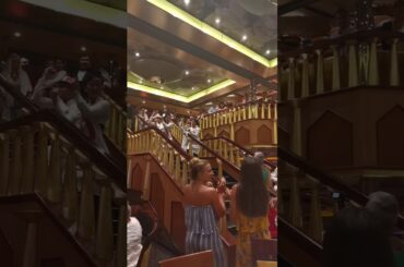 Waiters dance performance in ship cruise dinner hall with Italian song