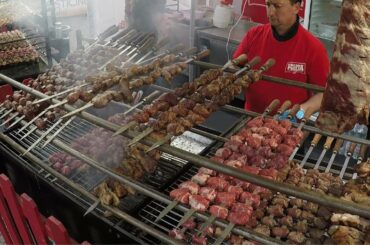 Italy Street Food. Pig Knuckles, Lamb, Pork Skewers, Melted Cheese, Focaccia, Dry-Cured Ham, Paella