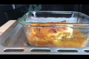 BAKED FISH FILLET IN TOMATO LEMON BROTH AND CHEESE.