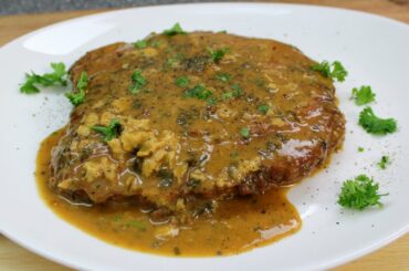 A pan of pork chops in a delicate white wine sauce!