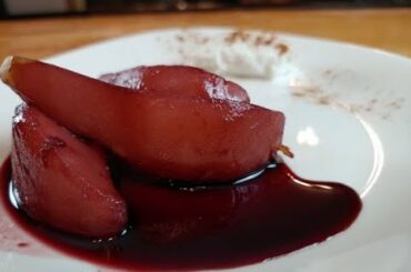 Pears pouched in Red wine, served with vanilla ice cream