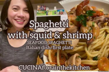 Spaghetti with squid and shrimp//seafood spaghetti. Italian dish.