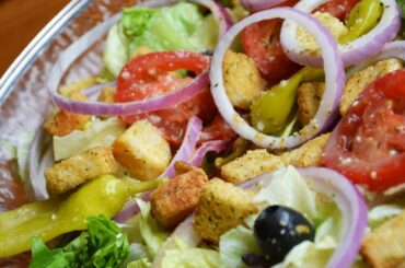 Here's What Really Makes Olive Garden's Salad So Delicious