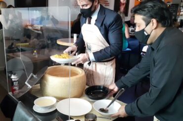 Las Vegas Italian restaurant owner shows how to make cheese sauce with a blow torch