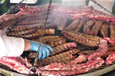 Street Food in Milano, Italy. Ribs, Burgers, Grilled Pork, Fried Pizza, Seafood, Pita Gyros, Crepes