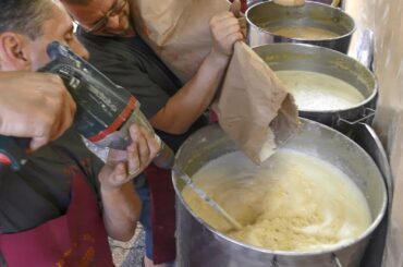 Italy Street Food. Cooking the  'Farinata', Chickpea Flour Pancake