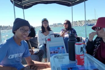 Beautiful hot summer day boat cruising at the Grand Canal in Balboa Island Newport Beach CA