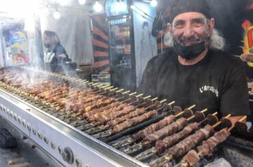 Italy Street Food Fair. Small Sticks of Sheep Meat Roasted on Charcoal. "Arrosticini"