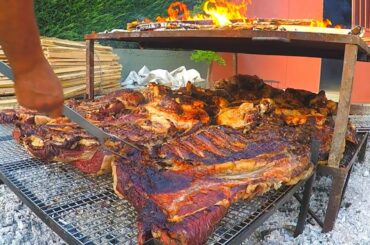 Italian Street Food Festival of Bull Meat. Huge Blocks of Meat on Grill