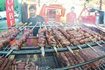 Huge Swords of Pork Meat with Cheese, Ribs, Sausages. Italy Street Food