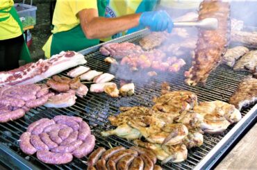 Italy Street Food Festival. Huge Grill, Roasted Piglet, Pork and Lamb Skewers, PitaGyros, Sweets