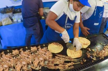 Street food from Greece. Fast Preparation of Pita Gyros with Lamb, Pork and Chicken. Italian Event