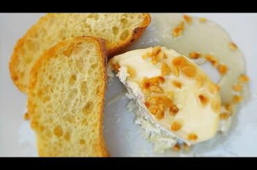 Trying three milk cheese with honey and hazelnuts in Italy