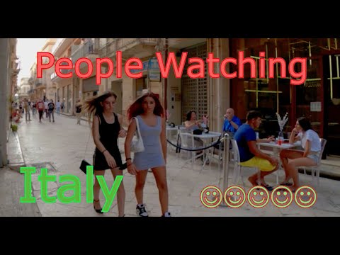 Rose and Will drink a glass of wine at a street bar in Italy Rose and Will drink a glass of wine at a street bar in Italy