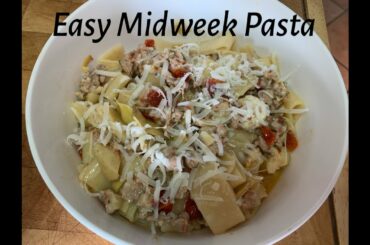 Pasta with sun-dried tomatoes, artichoke hearts, fresh mozzarella and sausage