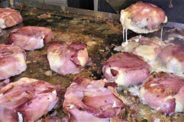 Yummy Burgers with Melted Cheese and Speck. Italy Street Food. 'Cheese' Festival, Bra