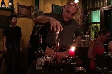 Owner Giovanni decants wine for our table at La Gaetana- Phuket, Thailand