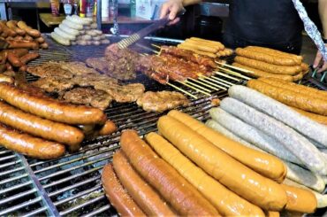 Huge Grill of Meat from Poland. Giant Sausages, Pork Legs, Ribs, Steaks. Italy Street Food Event