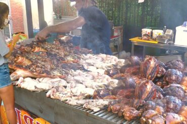 Italy Street Food. Biggest Whole Bull Roasted, Pork Knuckles, Mixed Meat on Grill, Sausages