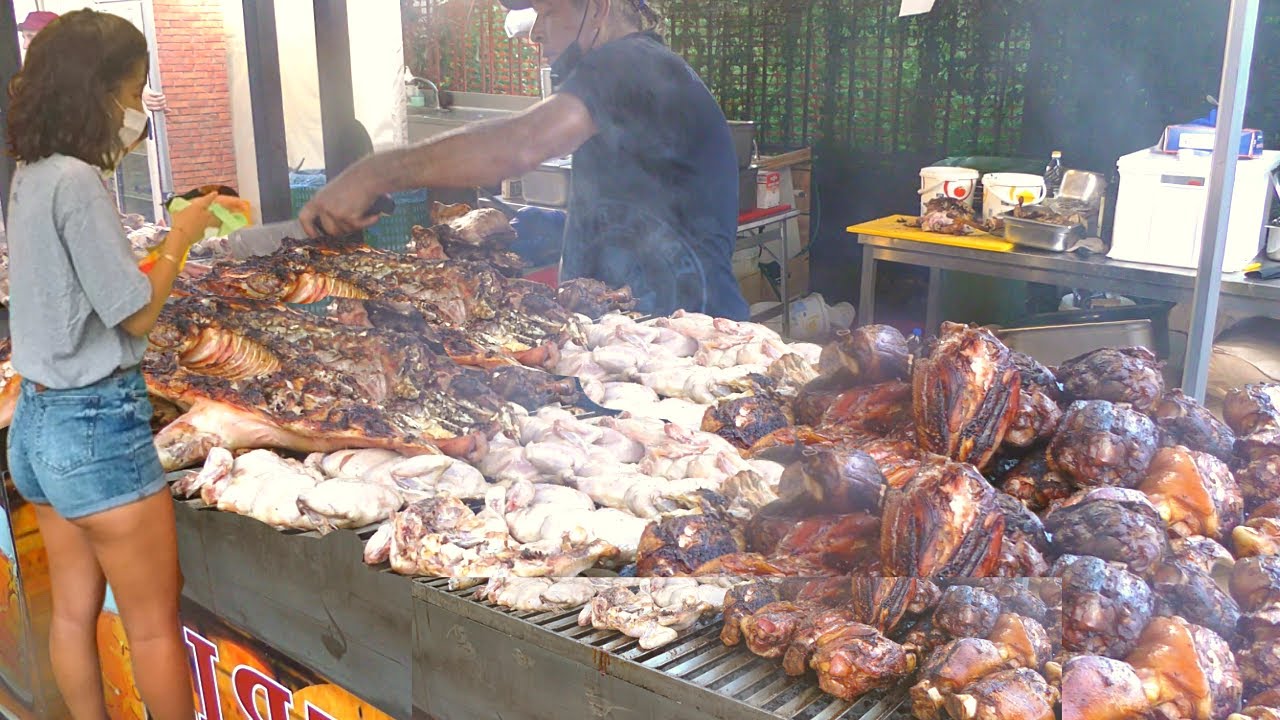 Italy Street Food. Biggest Whole Bull Roasted, Pork Knuckles, Mixed Meat on Grill, Sausages Italy Street Food. Biggest Whole Bull Roasted, Pork Knuckles, Mixed Meat on Grill, Sausages