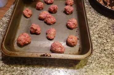 old fashioned  italian. cooking rototina meat  sauce and meat balls
